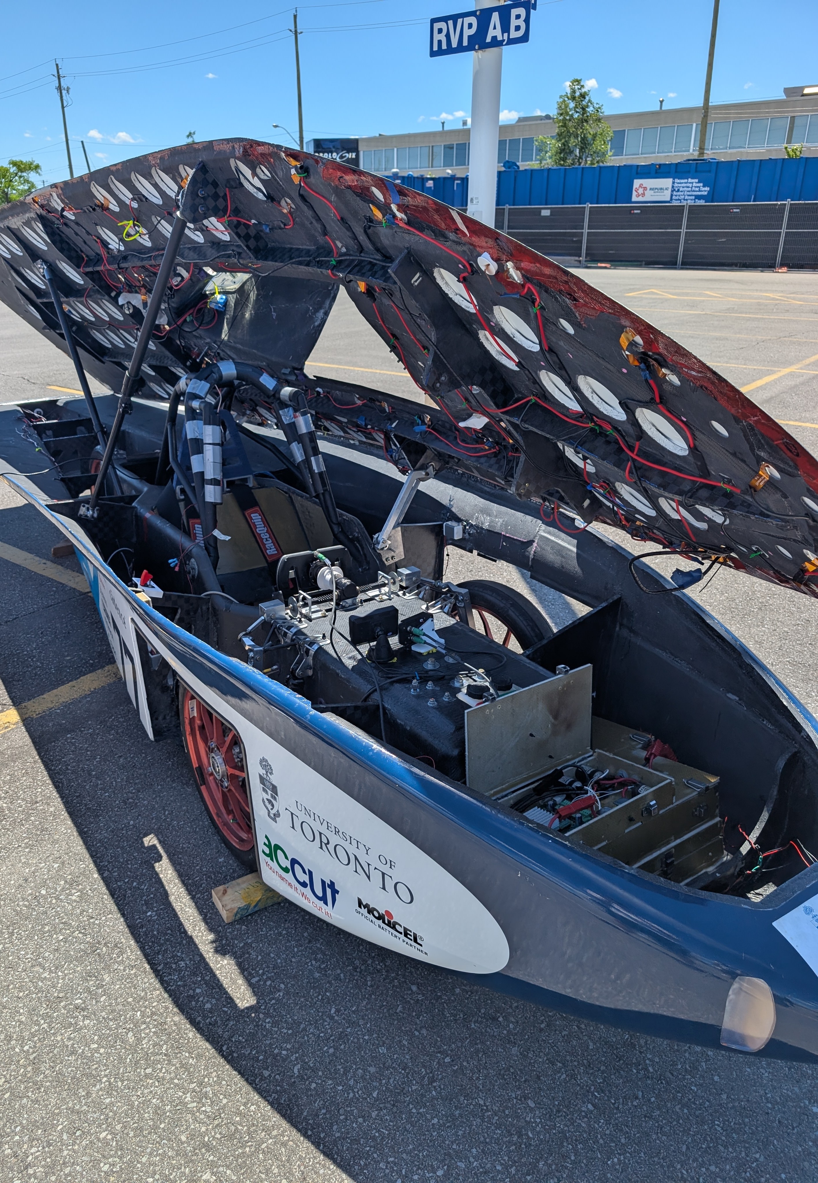 A photo of the car with the solar panels tilted to the side, so you can see in the inside of the vehicle