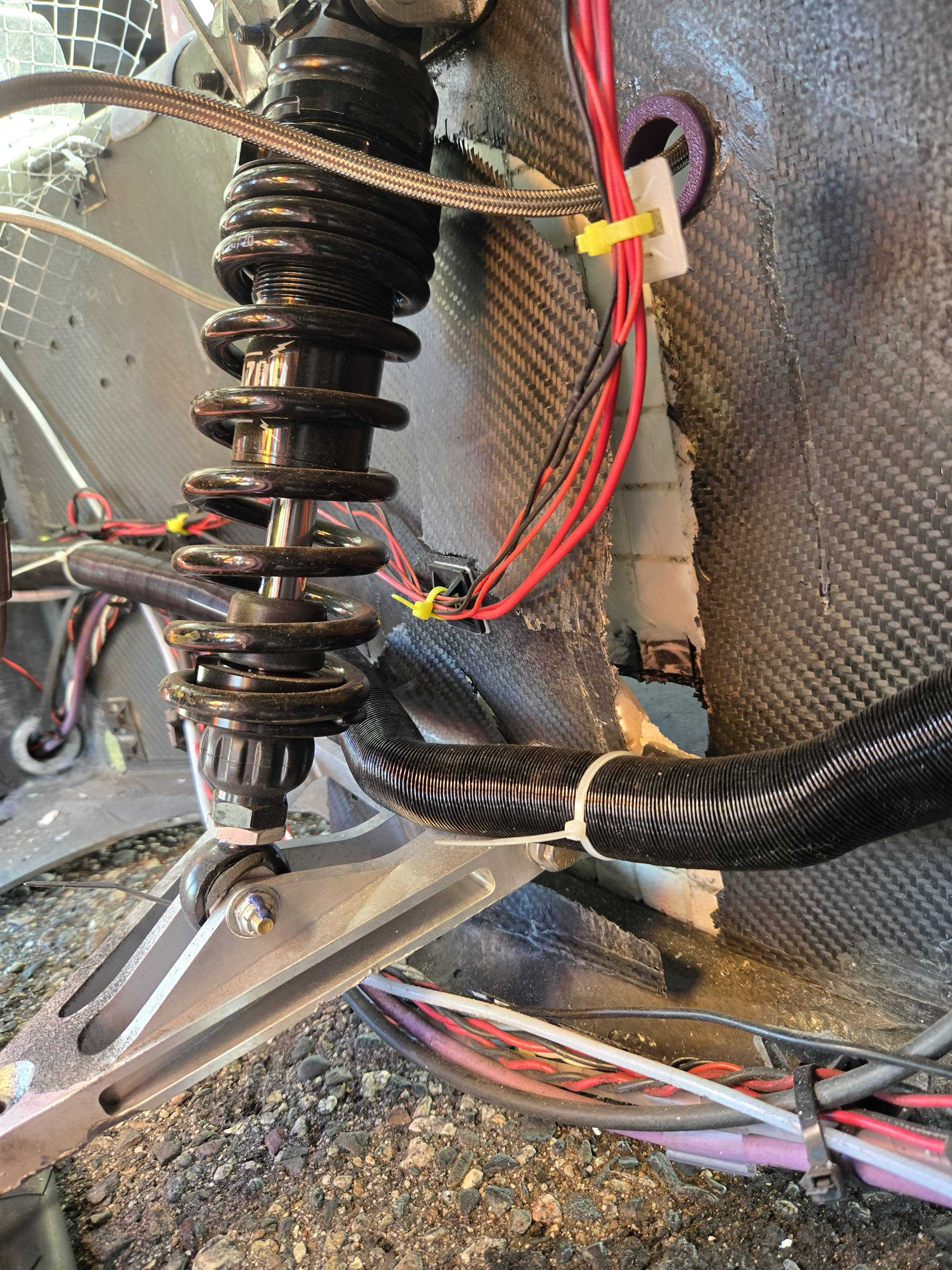A photo of the car chassis which a rip by the where suspension mounts