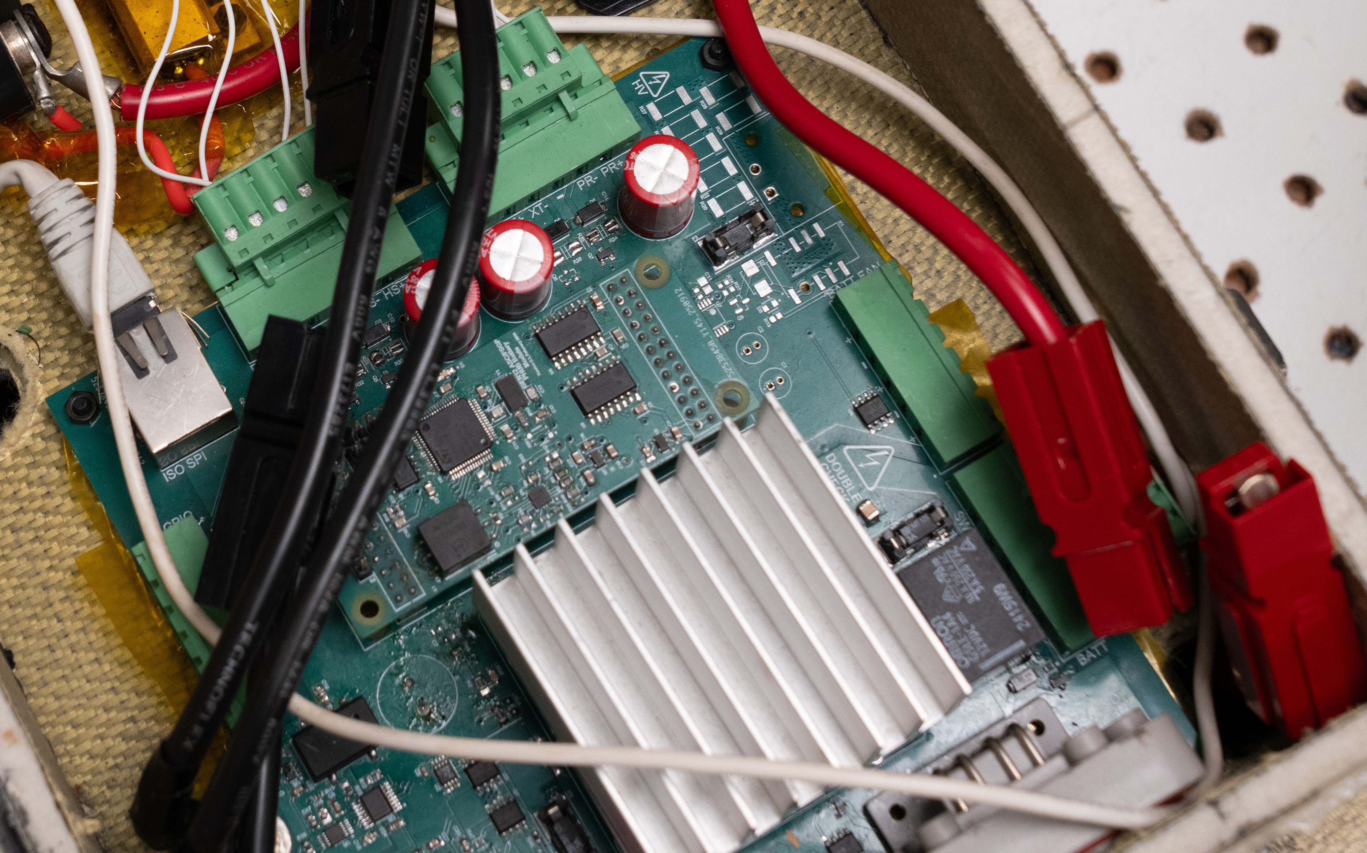 A photo of the power hub circuit board installed in the battery box
