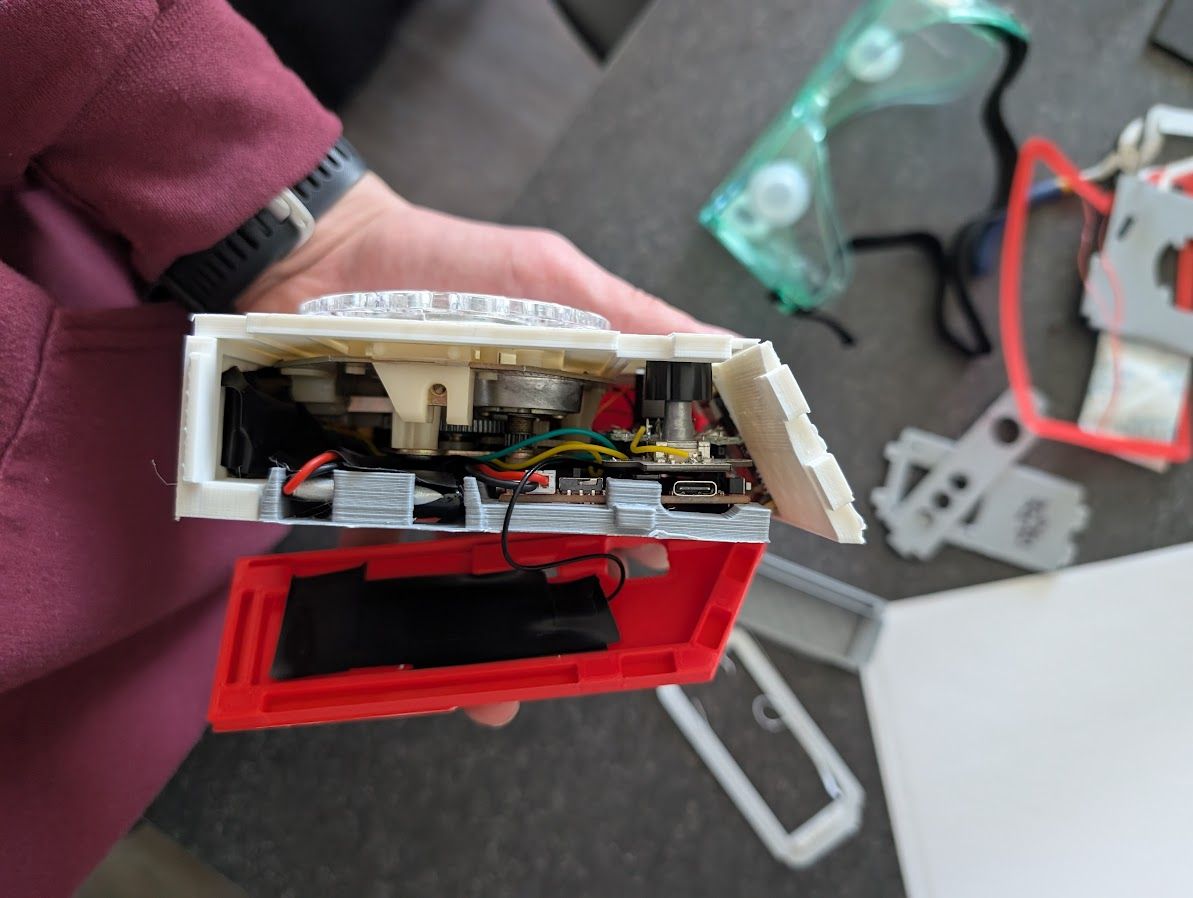 A cross section of the rotary phone, with one of the side panels removed