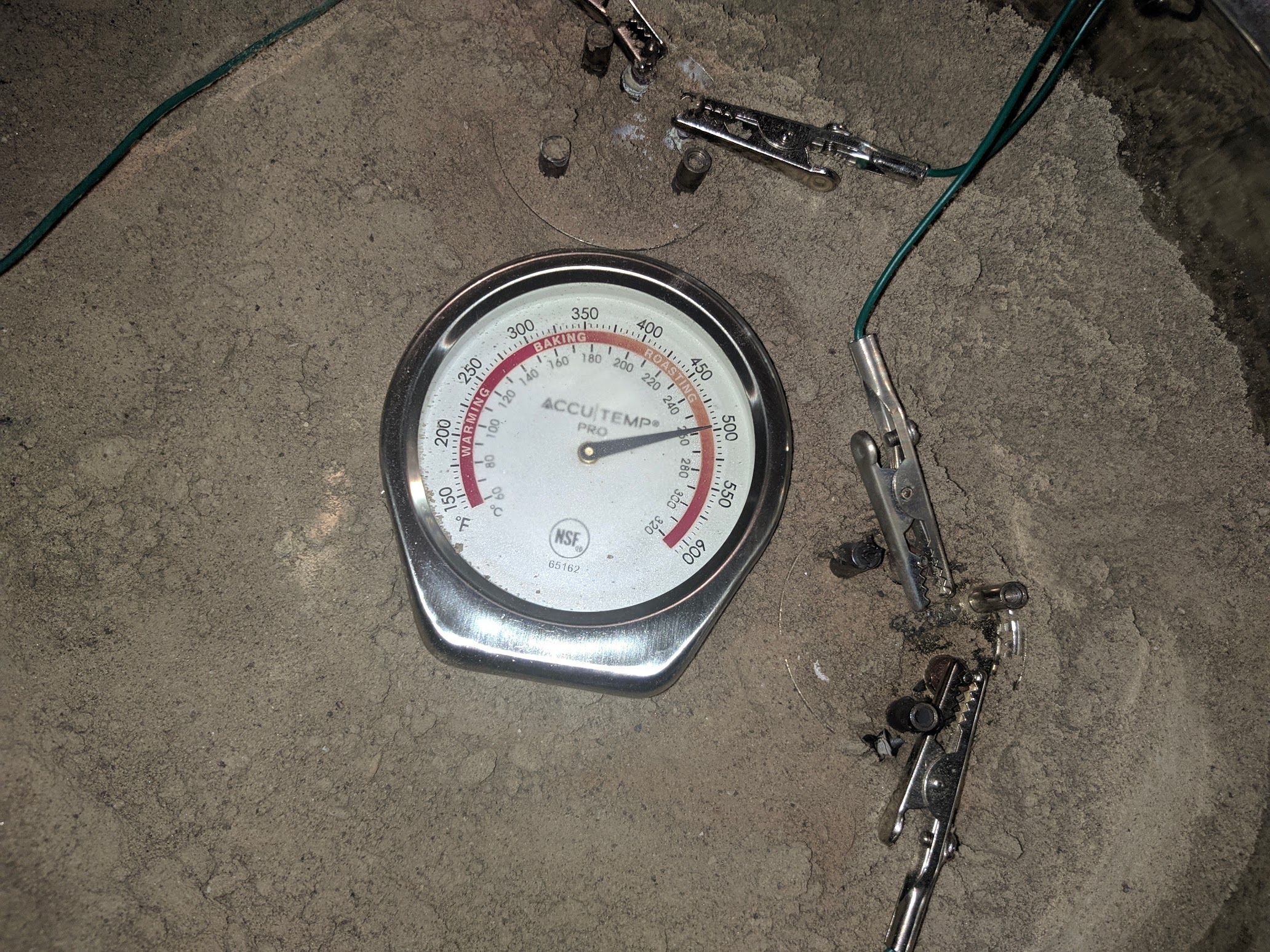 The themometer in the bucket showing 260 degrees Celsius